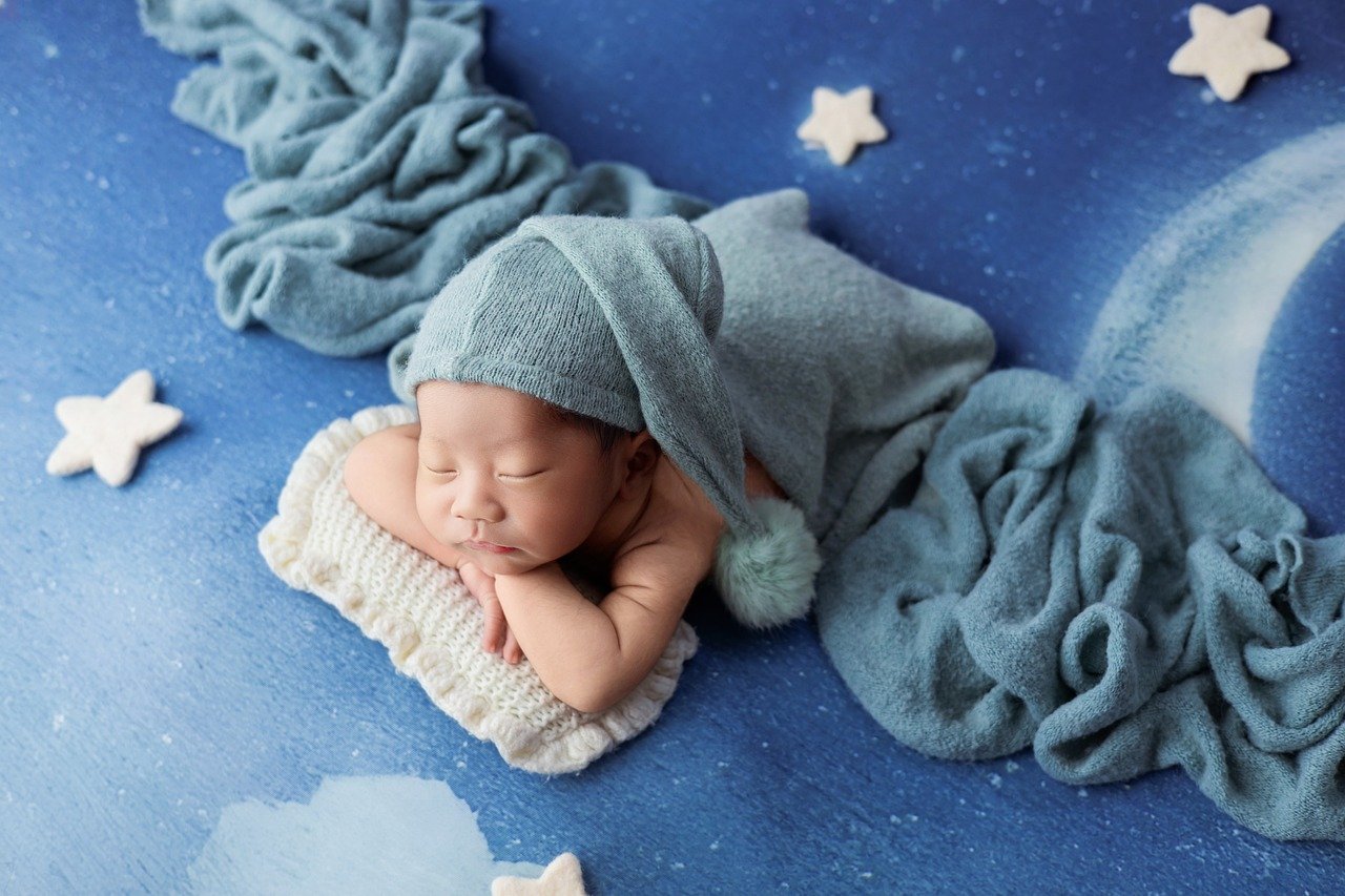 Peacefully sleeping baby in crib